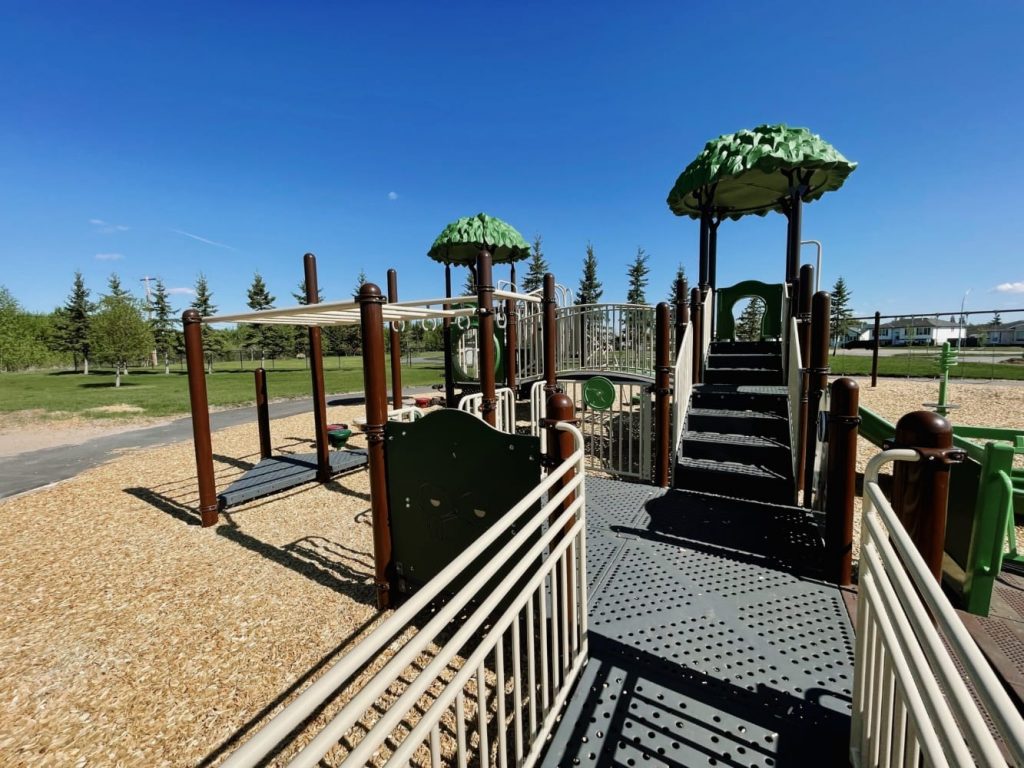 Memorial Park-6 Close up view of Wheelchair Ramp, Challenge Ladder, Simon Says Panel, Steering Wheel, and Deck to Deck Steps.