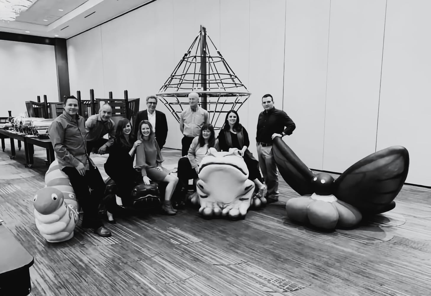Black and white team photo of Jedd Russell, Robert McCoy, Lauren Sinclair, Katie Hodgins, Lori Vogelaar, and Kylie Russell in Las Vegas, NV.