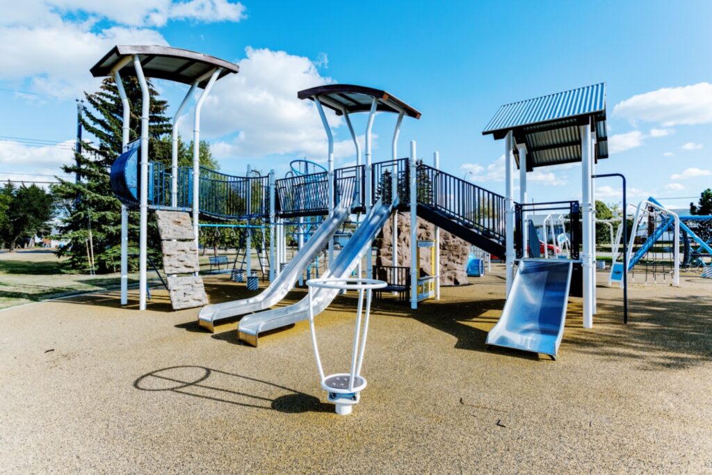 Albert G. Nickel Park-7 Albert G. Nickel Park in Edmonton, AB with Nu-Edge Rock Wall, two Stainless Steel Single Slides, Barrel Ride, Deck to Deck Steps, Stainless Steel Double Slide, and Sliding Pole.