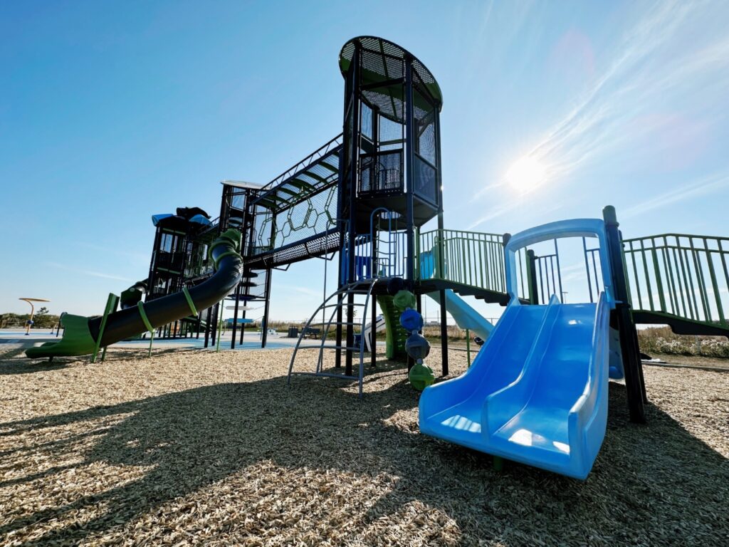 Pogadl Park-5 Pogadl Park in Sylvan Lake, AB with close up view of Bump and Glide Slide, Deck to Deck Steps, Dome Climber, Hives Skyway, S-Shaped Tube Slide, and Hurricane Tower.