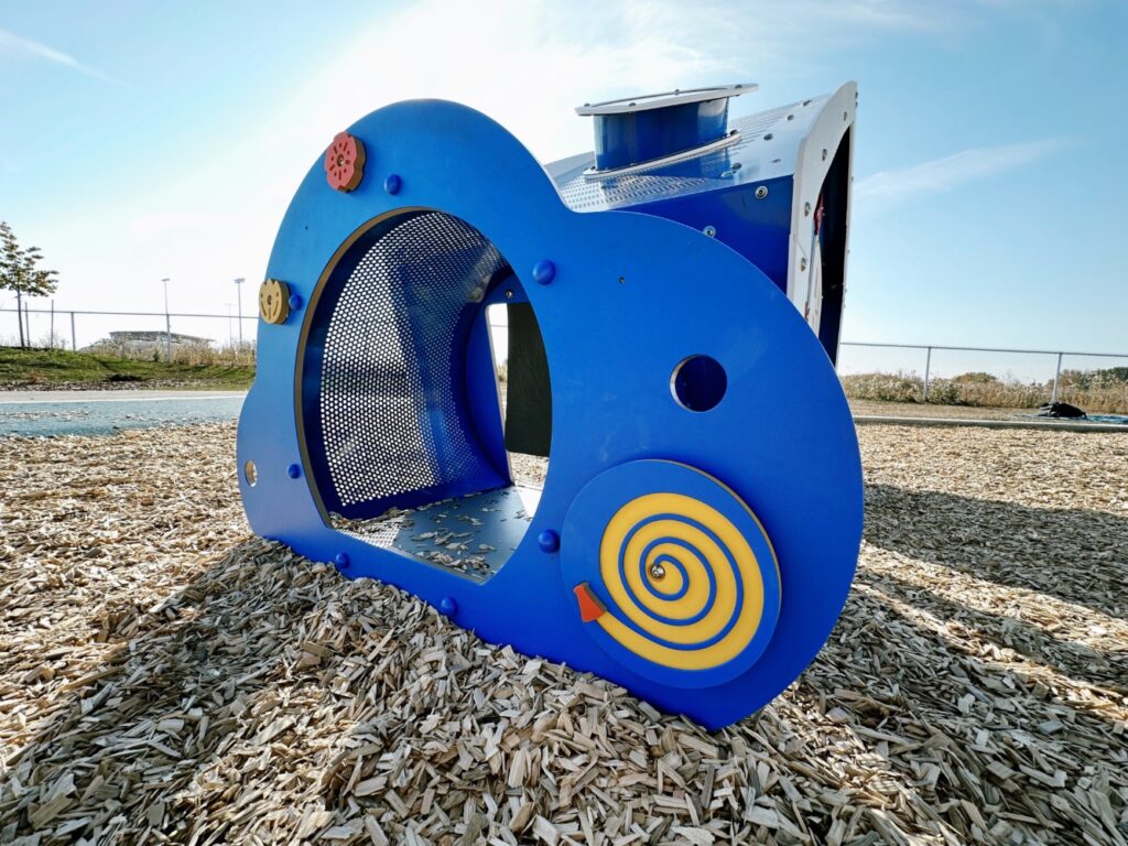 Pogadl Park-8 Close up view of Tot Builders Playhouse and Engineered Wood Fiber Surfacing.