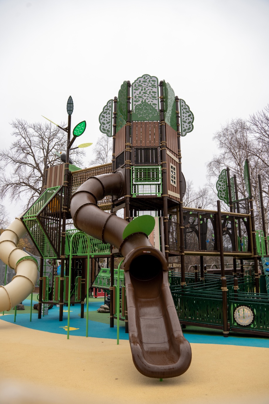 Brown tube slide on the tree tower at Lheidli T'enneh Memorial Park in Prince George, BC.