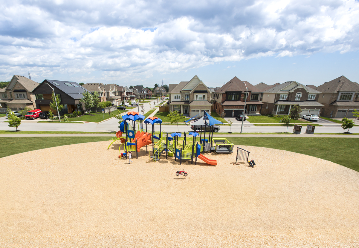Aerial view of a compact playground design in a new neighborhood, reflecting typical commercial playground cost.