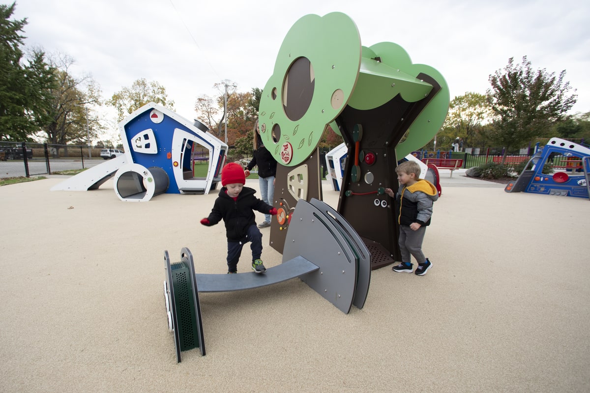 Sensory tree panel and balance bridge for toddlers, a feature worth adding to any playground planning checklist.